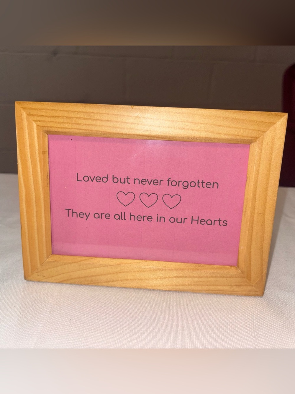 Wood Frame with Pink Memorial Sign